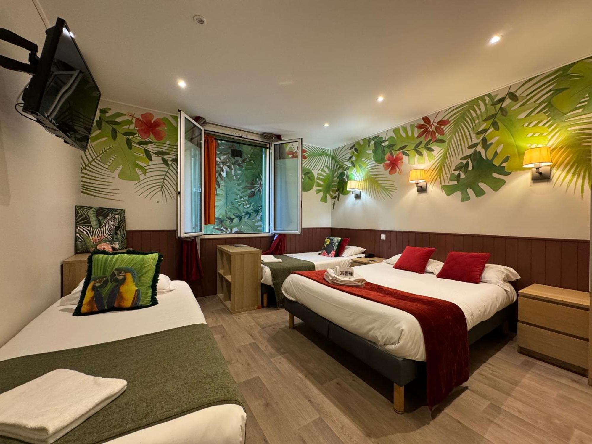 Classic Quadruple Room window overlooking a painted wall