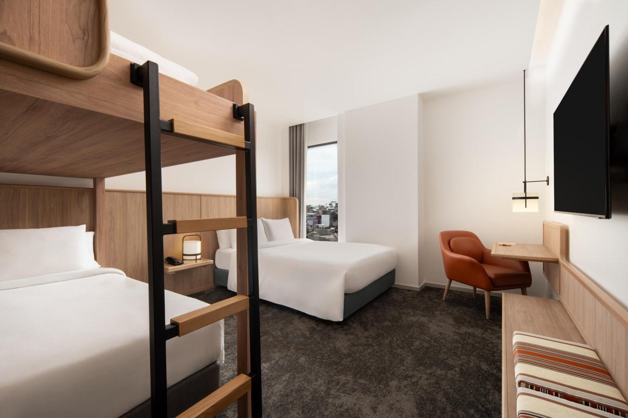 Hébergement Lit Queen-Size Spacieux avec Lits Superposés