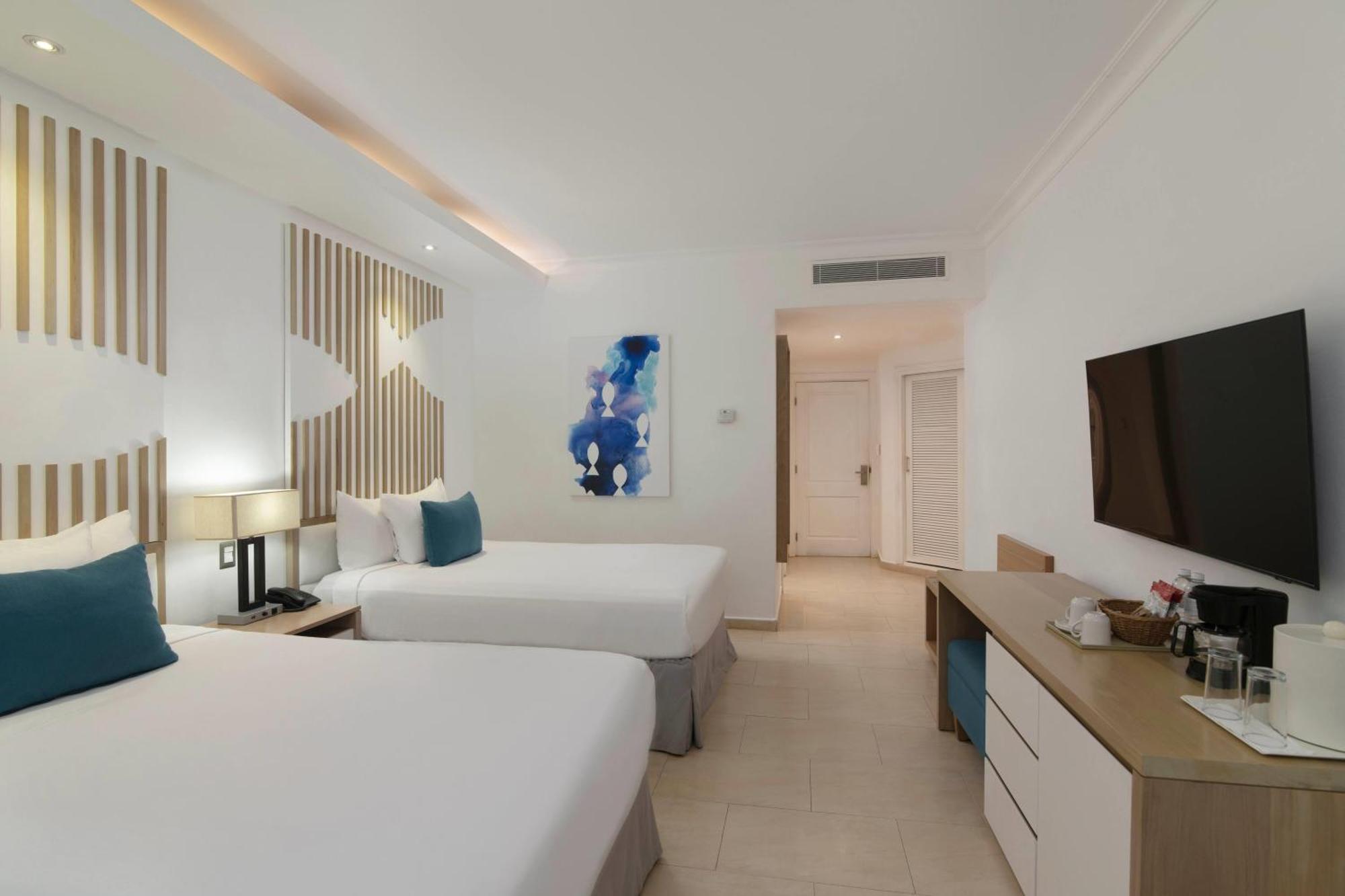 Chambre Club avec 2 Lits Doubles - Vue sur Océan